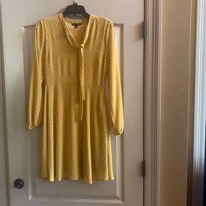 Mustard A-line dress tie in the front- great for a spring or summer wedding